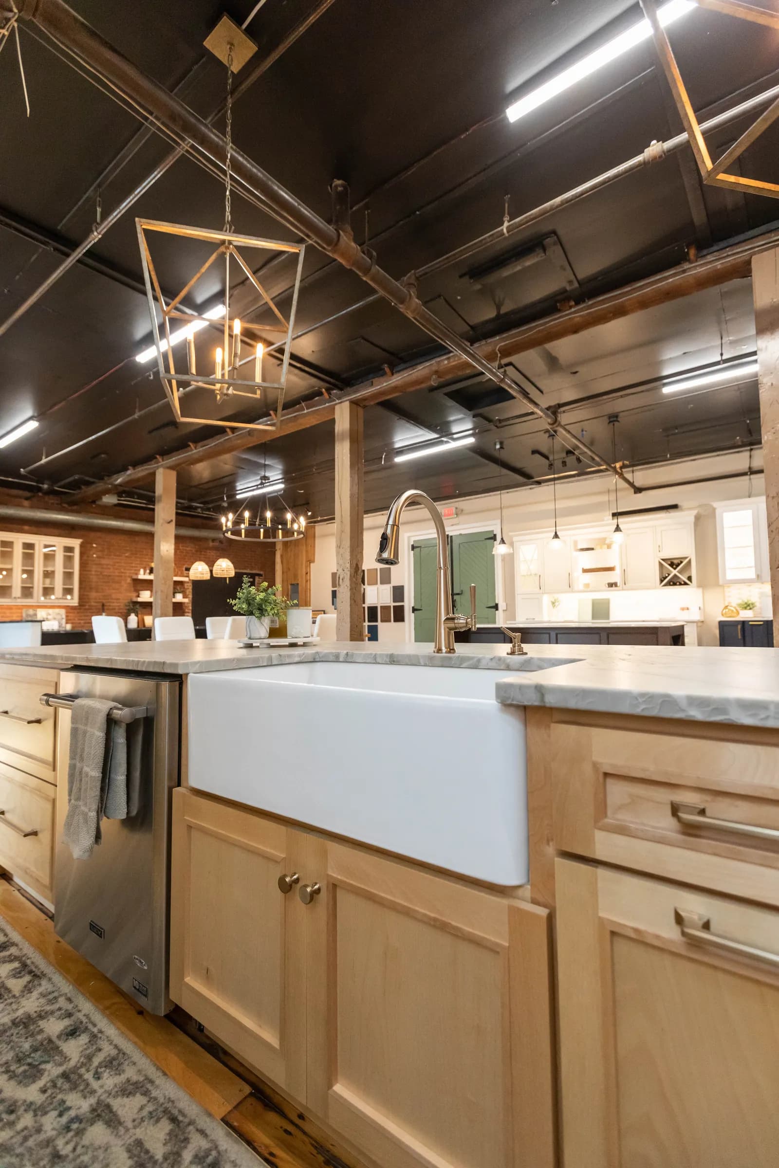 Farmhouse sink island with brass fixtures