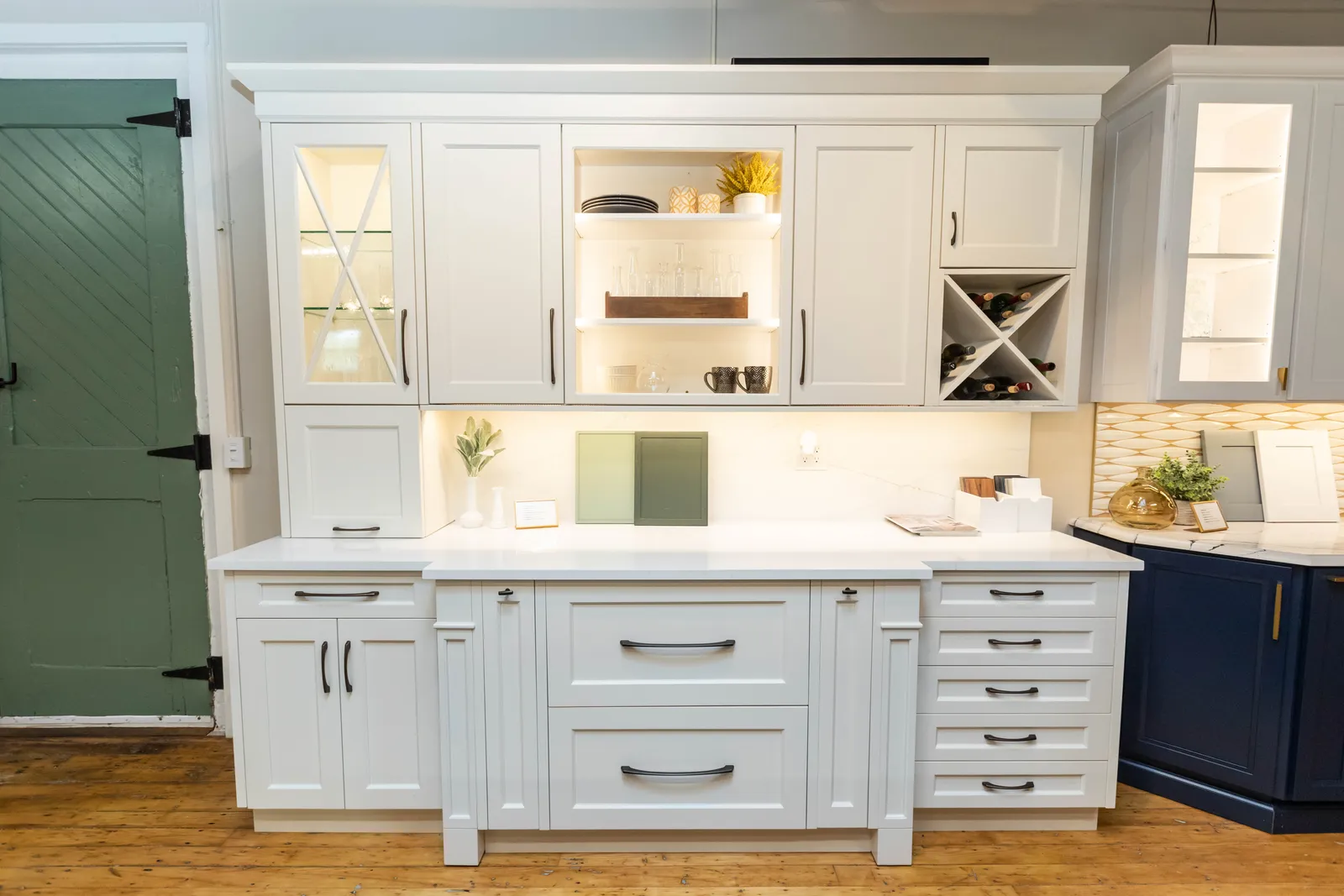 White cabinet display with glass doors and wine rack